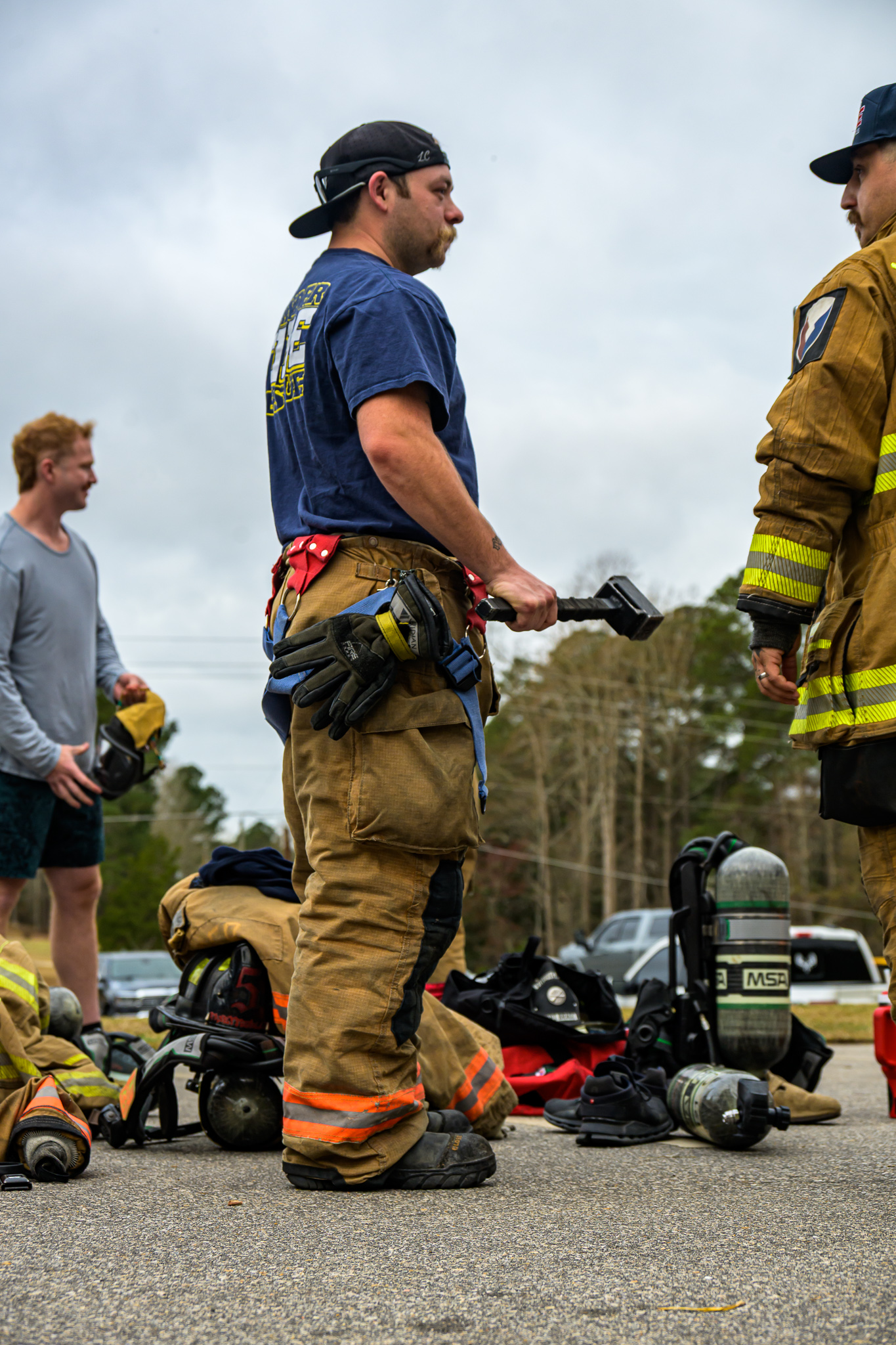 Firefighter holding forcible entry tool