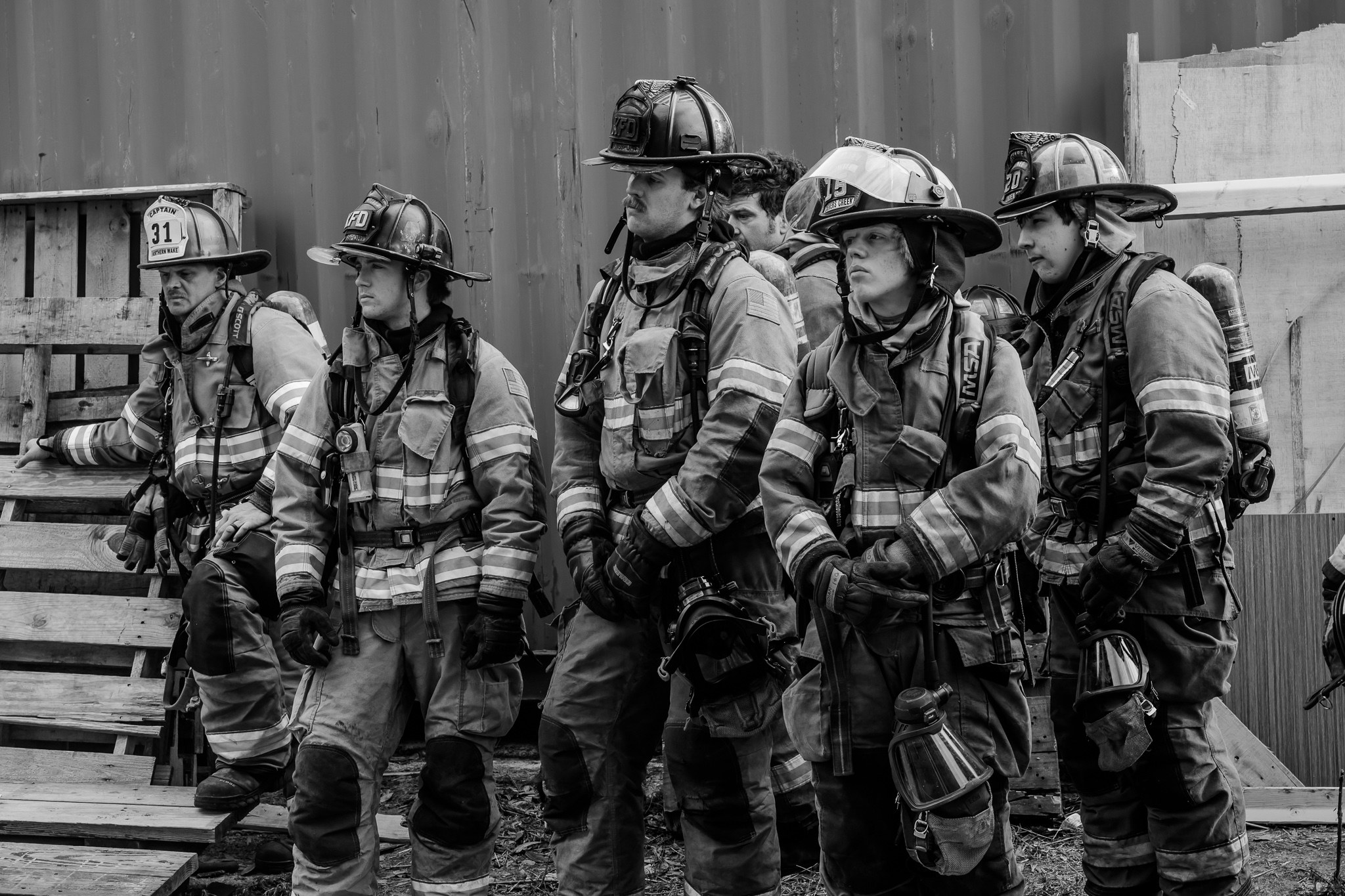 Crew standing and listening